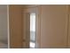 Bedroom door featuring a full length mirror and neutral wall paint at 33 Newburg Ave, North Las Vegas, NV 89032