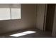 Bedroom featuring natural lighting, closet, and neutral walls at 33 Newburg Ave, North Las Vegas, NV 89032