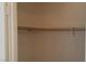 Interior of closet featuring one wooden rod for hanging clothes at 33 Newburg Ave, North Las Vegas, NV 89032