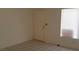 Entryway features tiled floors, a front door, a window with blinds, and neutral paint colors at 33 Newburg Ave, North Las Vegas, NV 89032