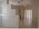 Living room boasts tiled floors, neutral paint, sliding glass doors with blinds, and a fireplace at 33 Newburg Ave, North Las Vegas, NV 89032