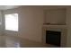 Living room featuring a fireplace with tile surround and neutral paint colors at 33 Newburg Ave, North Las Vegas, NV 89032