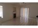 Living room features tile flooring, a fireplace, sliding glass doors with blinds, and neutral paint at 33 Newburg Ave, North Las Vegas, NV 89032