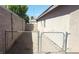 Gated side yard access creates a secure and functional outdoor area at 33 Newburg Ave, North Las Vegas, NV 89032