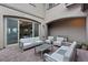 Backyard features a brick-paved patio, a comfortable seating area, and a sliding glass door to the interior at 342 Molinetto St, Las Vegas, NV 89138