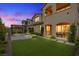 The backyard has an outdoor patio with synthetic grass and a pergola at 342 Molinetto St, Las Vegas, NV 89138