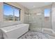 Bathroom featuring a tub and an adjacent walk-in shower at 342 Molinetto St, Las Vegas, NV 89138