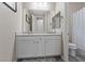 A bathroom with dual sinks and a large mirror at 342 Molinetto St, Las Vegas, NV 89138