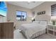 Cozy bedroom with a queen bed, a large window, and neutral decor at 342 Molinetto St, Las Vegas, NV 89138