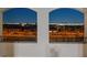 A beautiful city view seen through a balcony with wrought iron railing at nighttime at 342 Molinetto St, Las Vegas, NV 89138