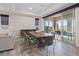 Dining room with recessed lights, stylish furnishings, and sliding glass doors to the outdoor space at 342 Molinetto St, Las Vegas, NV 89138