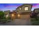 Attractive two-story home featuring neutral stucco, a two-car garage, and easy-care landscaping at 342 Molinetto St, Las Vegas, NV 89138