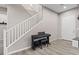 Welcoming home foyer with a staircase, piano, tiled floor, and bright interior at 342 Molinetto St, Las Vegas, NV 89138