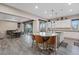 Open kitchen with a large island with bar seating, stainless steel appliances, and adjacent dining area at 342 Molinetto St, Las Vegas, NV 89138