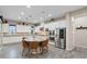 Bright and airy kitchen with stainless steel appliances, island with seating and overhead lighting at 342 Molinetto St, Las Vegas, NV 89138