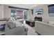Bright living room with recessed lights, TV, and sliding glass doors to the patio at 342 Molinetto St, Las Vegas, NV 89138