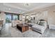Open-concept living room seamlessly connecting the dining and kitchen areas, perfect for modern living at 342 Molinetto St, Las Vegas, NV 89138