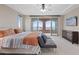 Main bedroom with an attached balcony and a ceiling fan at 342 Molinetto St, Las Vegas, NV 89138