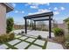 Backyard pergola seating area with modern design and pavers at 342 Molinetto St, Las Vegas, NV 89138