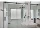 Modern bathroom showcasing a walk-in shower with glass door, built-in shelves, and rainfall shower head at 345 Templeton Dr, Henderson, NV 89074