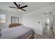 Comfortable bedroom with a ceiling fan, a wooden dresser, and doorway leading to a bedroom at 345 Templeton Dr, Henderson, NV 89074