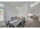 Bright dining room featuring modern lighting, an open floor plan, and a view of the living space at 345 Templeton Dr, Henderson, NV 89074