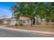 Charming home with a two-car garage, landscaped front yard, and a classic southwestern-style roof at 345 Templeton Dr, Henderson, NV 89074