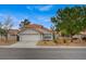 Charming home with a two-car garage, landscaped front yard, and a classic southwestern-style roof at 345 Templeton Dr, Henderson, NV 89074