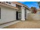 Welcoming front entrance with gated access and well-maintained landscaping, offering privacy and curb appeal at 345 Templeton Dr, Henderson, NV 89074
