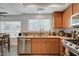 Kitchen features stainless steel appliances, countertops, and view into backyard at 345 Templeton Dr, Henderson, NV 89074