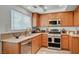 Well-equipped kitchen with stainless steel appliances, countertops, and ample cabinetry at 345 Templeton Dr, Henderson, NV 89074