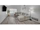 Comfortable living room featuring a large sectional sofa, modern decor, and ample natural light from a window at 345 Templeton Dr, Henderson, NV 89074