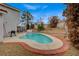 An inviting backyard showcasing a kidney-shaped pool and patio area at 345 Templeton Dr, Henderson, NV 89074