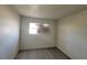 Bright bedroom with wood-look flooring and a window providing natural light and privacy at 3749 Ponderosa Ave, Las Vegas, NV 89115
