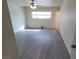 Bright, airy bedroom with modern ceiling fan and wood-look floors, great natural light at 3749 Ponderosa Ave, Las Vegas, NV 89115