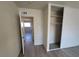 Neutral bedroom with closet and grey wood laminate flooring at 3749 Ponderosa Ave, Las Vegas, NV 89115