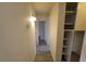 Well-lit hallway with built-in shelves and access to various rooms at 3749 Ponderosa Ave, Las Vegas, NV 89115