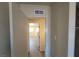 Hallway view showcasing new flooring and access to various rooms throughout the house at 3749 Ponderosa Ave, Las Vegas, NV 89115