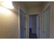Hallway view with multiple rooms leading to neutral finishes and great light at 3749 Ponderosa Ave, Las Vegas, NV 89115