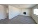 Bright living room boasting wood-look floors and a charming painted brick fireplace at 3749 Ponderosa Ave, Las Vegas, NV 89115