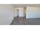Spacious living room featuring wood-look flooring and closet for ample storage at 3749 Ponderosa Ave, Las Vegas, NV 89115