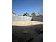 Empty backyard with tall block fence and blue sky at 3813 Marshall Cir, Las Vegas, NV 89108