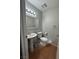 Bathroom featuring a white pedestal sink and tiled floor at 3813 Marshall Cir, Las Vegas, NV 89108
