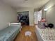 Bedroom with two beds, open closet and wood-look floors at 3813 Marshall Cir, Las Vegas, NV 89108