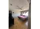 Bedroom with hardwood floors, ceiling fan and a window with natural light at 3813 Marshall Cir, Las Vegas, NV 89108