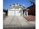 Two story home with a two car garage and neutral colored paint at 3813 Marshall Cir, Las Vegas, NV 89108