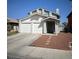 Two story home with a two car garage and neutral colored paint at 3813 Marshall Cir, Las Vegas, NV 89108