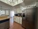 Modern kitchen with stainless steel refrigerator and white cabinets at 3813 Marshall Cir, Las Vegas, NV 89108