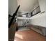 Bright living room featuring tile floors, a railing, a sofa and a media center at 3813 Marshall Cir, Las Vegas, NV 89108