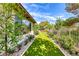 Lush backyard featuring a well-maintained lawn, landscaping, and privacy fencing at 4 Annadale Ct, Henderson, NV 89052